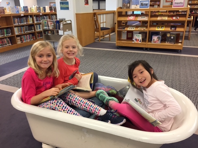 Who would think a simple bathtub could bring so much excitement to a library? It is either filled with eager readers or books for exchange at the end of each school year! What fun!