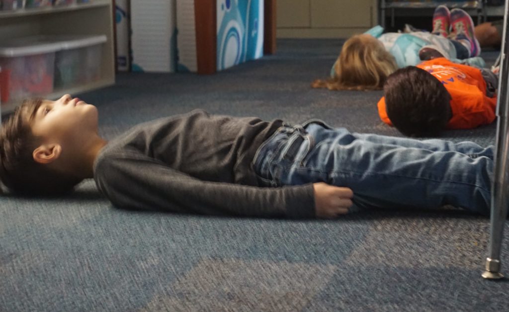 Some days in our classroom are started with a morning yoga video to prepare our minds and bodies for the day. Personally yoga has been beneficial and to watch first graders embrace this practice is inspiring. It is inspiring to see that they understand the importance of taking a few minutes to just breathe, be still, and relax. The calmness in the room is comforting and the mood is happy.<br />
<br />
Photo Caption:<br />
