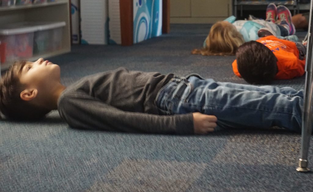 Some days in our classroom are started with a morning yoga video to prepare our minds and bodies for the day. Personally yoga has been beneficial and to watch first graders embrace this practice is inspiring. It is inspiring to see that they understand the importance of taking a few minutes to just breathe, be still, and relax. The calmness in the room is comforting and the mood is happy.<br />
<br />
Photo Caption:<br />
